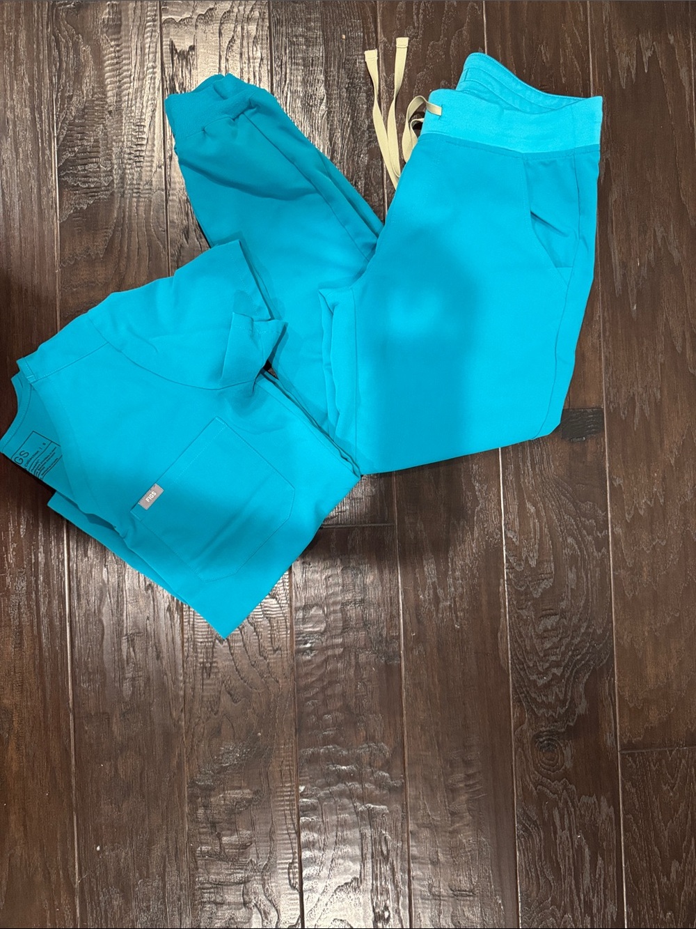 Figs Teal Medical Scrub Top with Front Pocket and jogger bottoms
